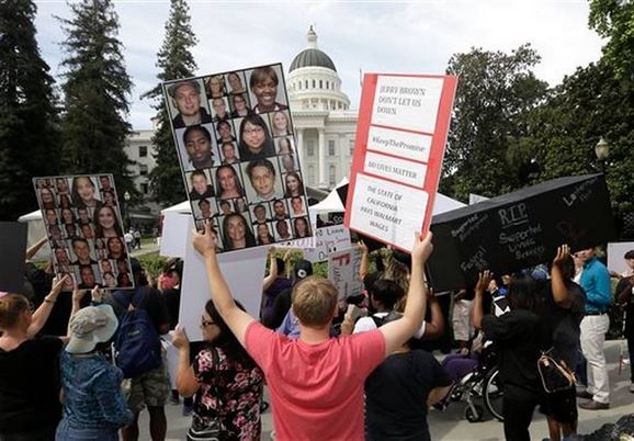 Protestors outside the capital in Sacramento, California