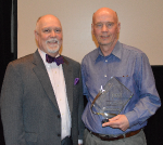Photo: (Left) Patrick Sandy,  CEO at Easter Seals Crossroads. (Right) James Van Dyke  holding the  James M. Hammond III Award