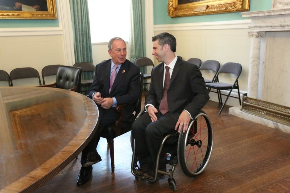 Victor Calise (right, pictured with former Mayor Michael Bloomberg), commissioner of the Mayor's Office for People with Disabilities. Photo credit: Spencer T. Tucker via NYC Mayor Office Flickr
